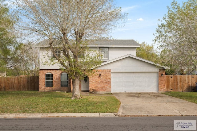 view of front of property with a garage and a front yard