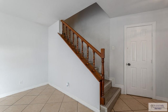 staircase with tile patterned flooring