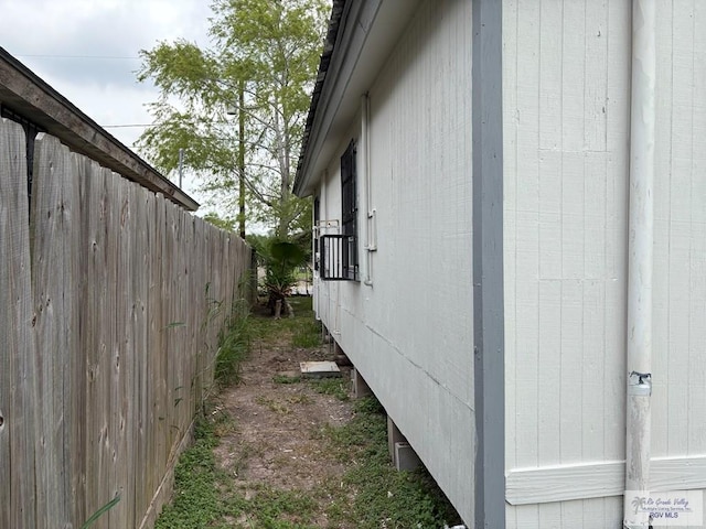 view of property exterior featuring fence