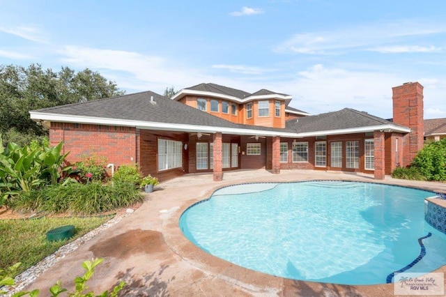 view of swimming pool featuring a patio area