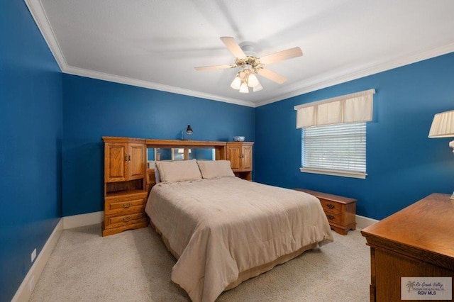 carpeted bedroom featuring crown molding and ceiling fan