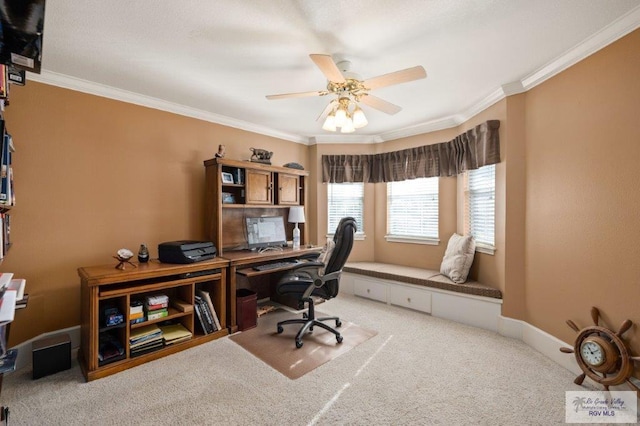 home office with crown molding, carpet floors, and ceiling fan