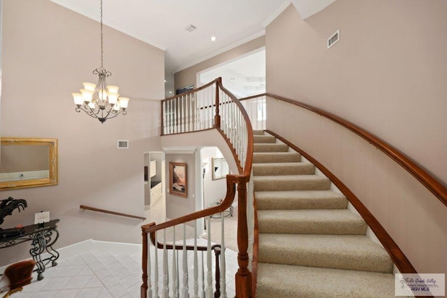 stairs featuring a high ceiling, crown molding, and a notable chandelier