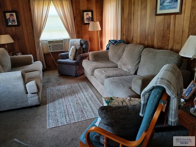 carpeted living room with cooling unit and wooden walls