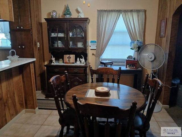 tiled dining room featuring plenty of natural light