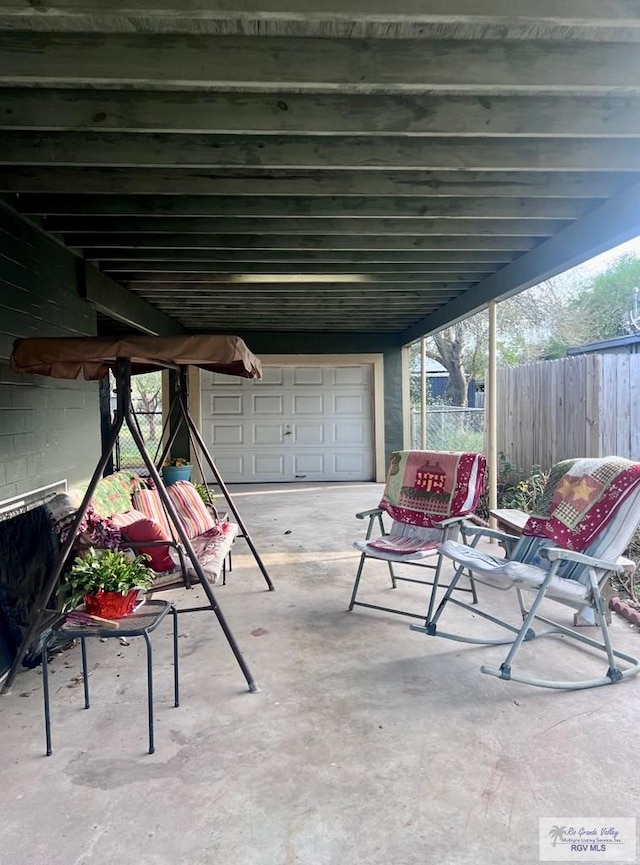 view of patio featuring fence