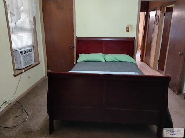 bedroom featuring cooling unit and light carpet