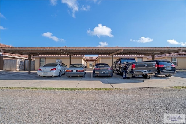 covered parking lot with fence