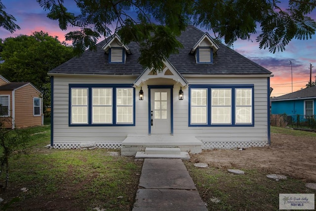 view of front of home with a yard