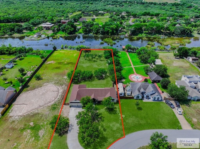25142 Teal Cir, San Benito, TX 78586 - aerial view with a water view and a residential view