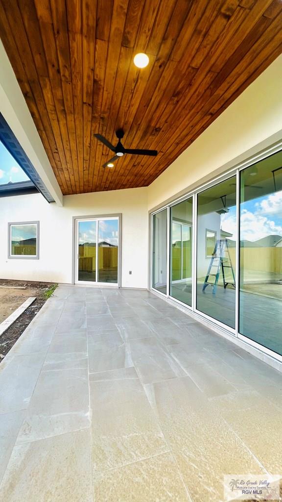 view of patio featuring ceiling fan