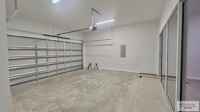 garage with electric panel and a garage door opener