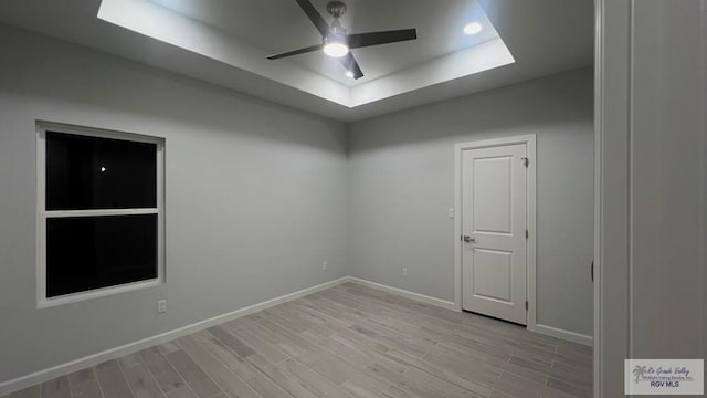 spare room with ceiling fan and light hardwood / wood-style flooring