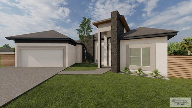 view of front facade with a front yard and a garage