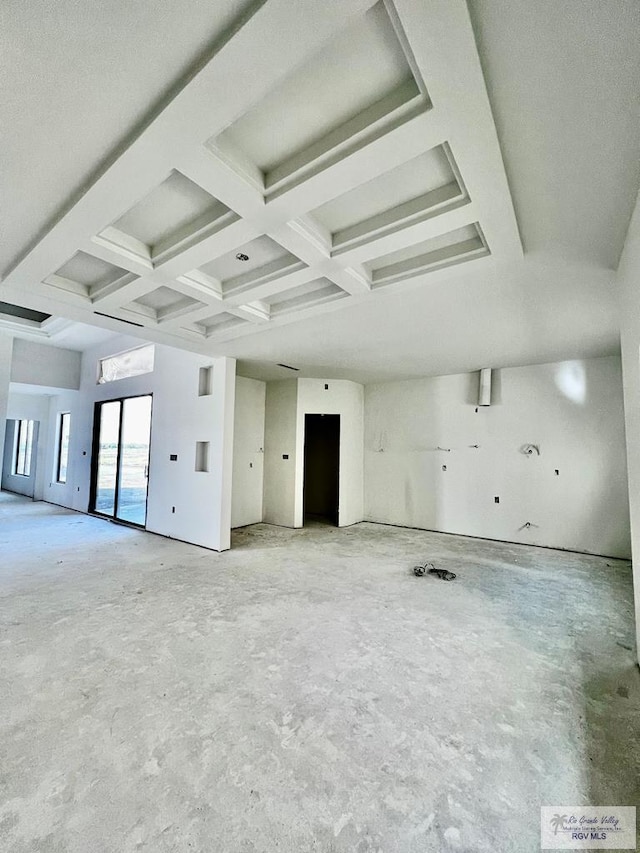 spare room with beamed ceiling and coffered ceiling