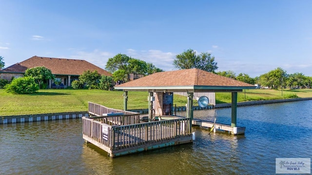 dock area with a water view and a lawn