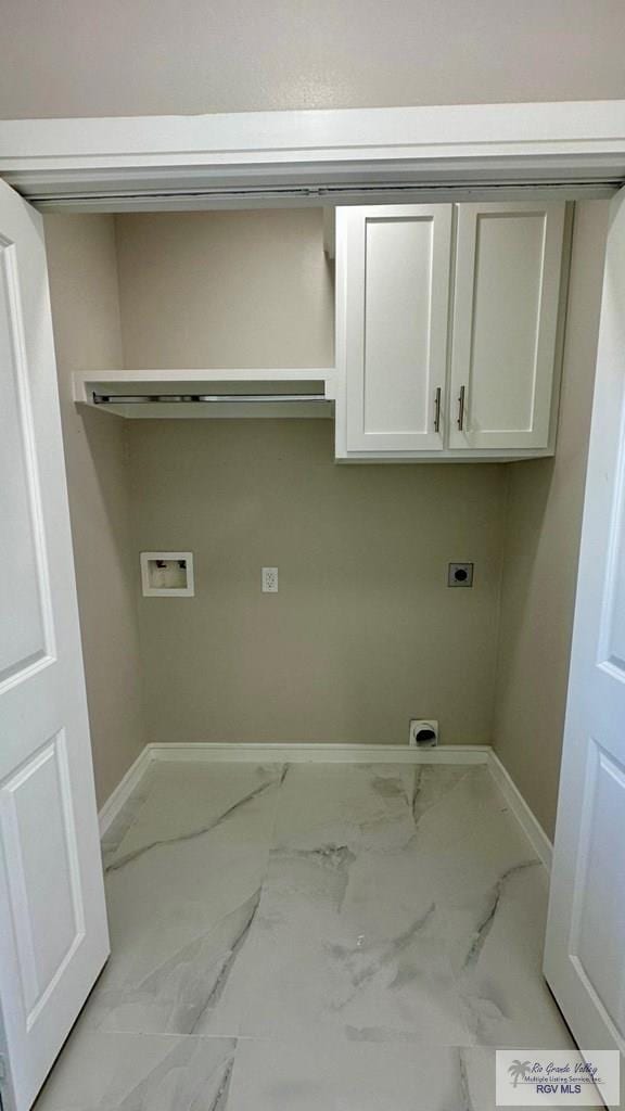 laundry room with baseboards, cabinet space, hookup for an electric dryer, and marble finish floor