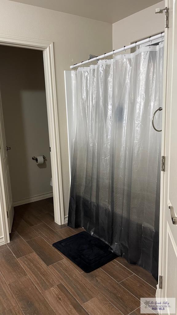 bathroom featuring hardwood / wood-style flooring