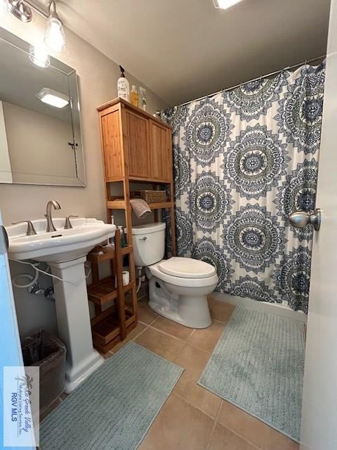 bathroom featuring tile patterned floors and toilet