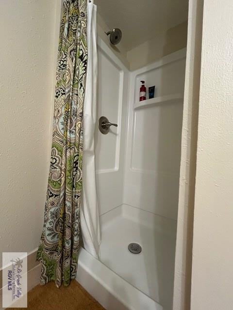 bathroom featuring a shower with curtain