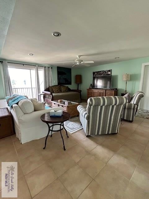 tiled living room featuring ceiling fan