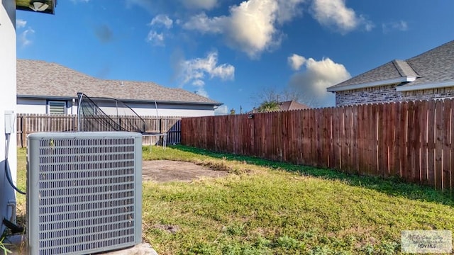 view of yard featuring a fenced backyard and cooling unit