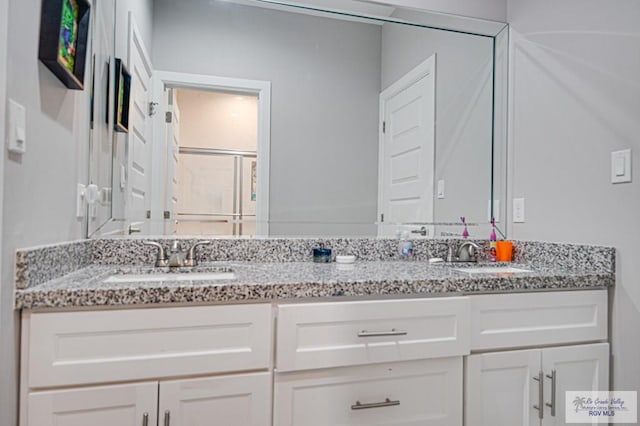 full bath featuring double vanity and a sink