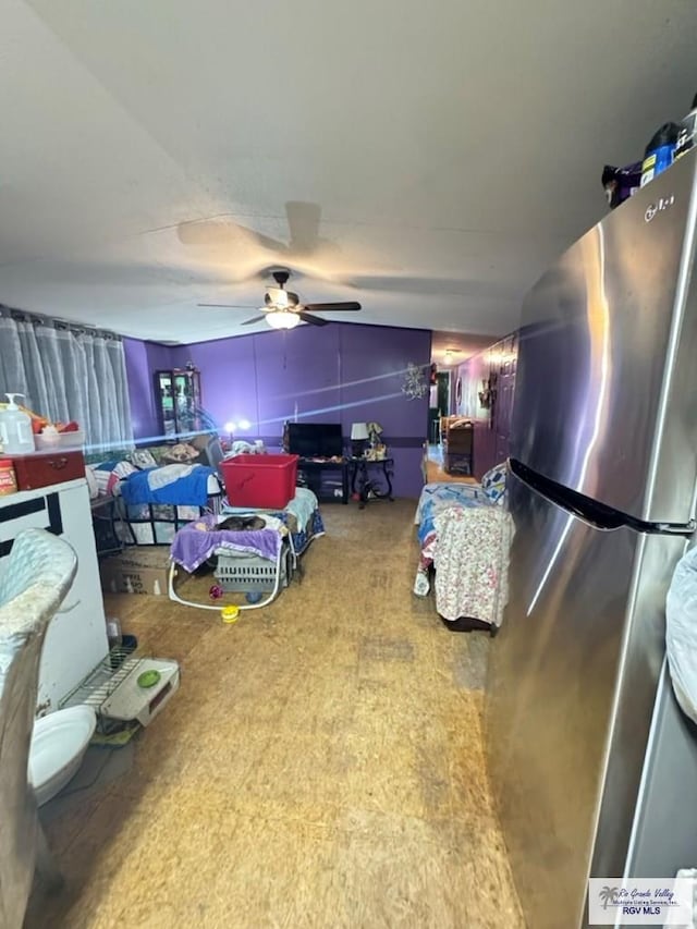 38639 Centerline Rd, Los Fresnos, TX 78566 - bedroom with freestanding refrigerator and a ceiling fan