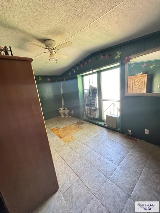38639 Centerline Rd, Los Fresnos, TX 78566 - unfurnished room with ceiling fan, vaulted ceiling, and a textured ceiling