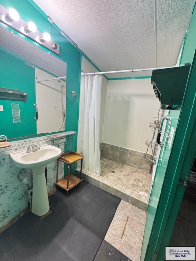 38639 Centerline Rd, Los Fresnos, TX 78566 - full bathroom with a shower stall and a textured ceiling