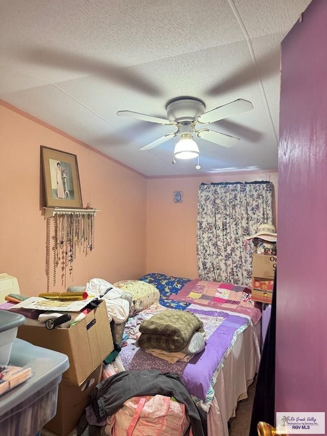 38639 Centerline Rd, Los Fresnos, TX 78566 - bedroom with a ceiling fan, vaulted ceiling, and a textured ceiling
