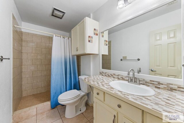 bathroom with tile patterned floors and vanity