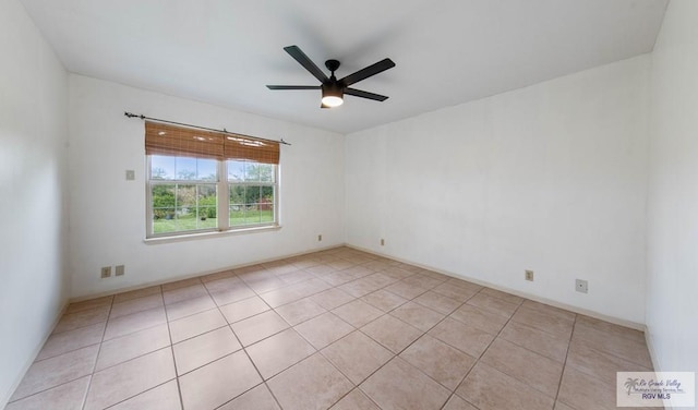 unfurnished room featuring ceiling fan and light tile patterned floors