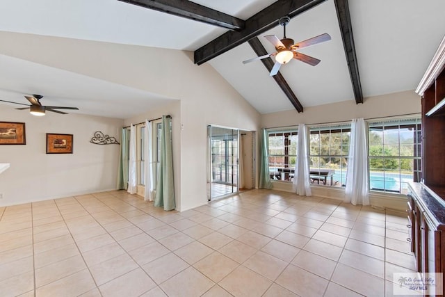 spare room with vaulted ceiling with beams, a ceiling fan, and light tile patterned flooring