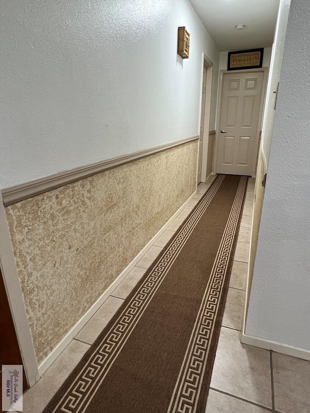 hallway with light tile patterned floors