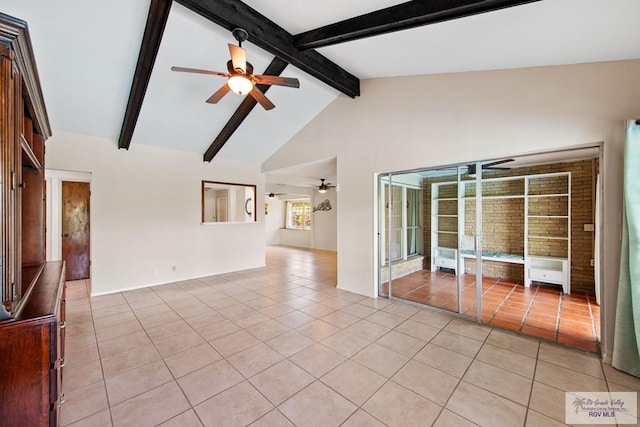 unfurnished room featuring lofted ceiling with beams, light tile patterned floors, and a ceiling fan