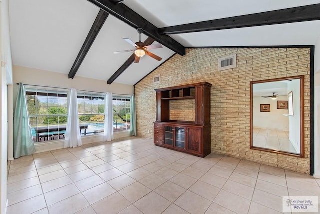 unfurnished living room featuring light tile patterned floors, lofted ceiling with beams, a sunroom, brick wall, and ceiling fan