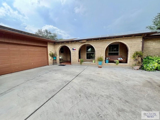 ranch-style house featuring a garage