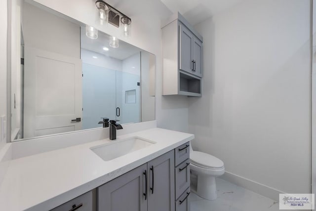 bathroom featuring vanity, toilet, and walk in shower