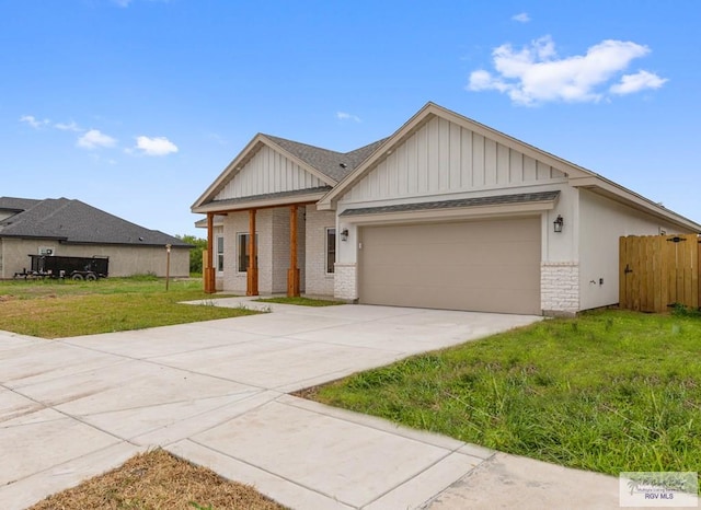 view of front facade featuring a garage and a front lawn