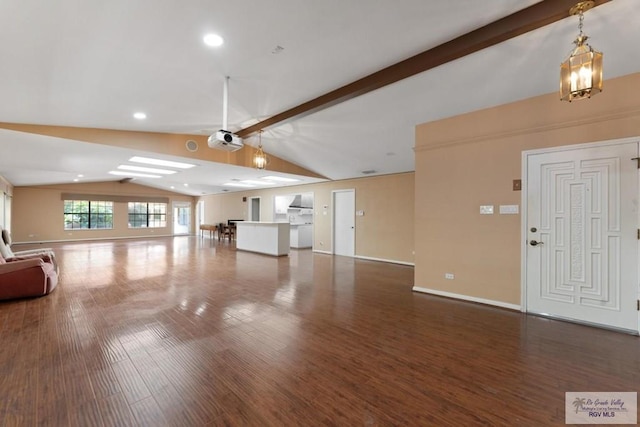 unfurnished living room featuring lofted ceiling with beams and dark wood-type flooring