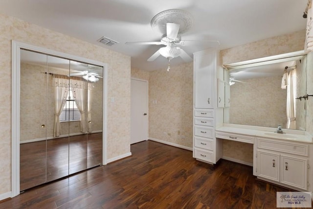 bathroom with hardwood / wood-style flooring, ceiling fan, and vanity