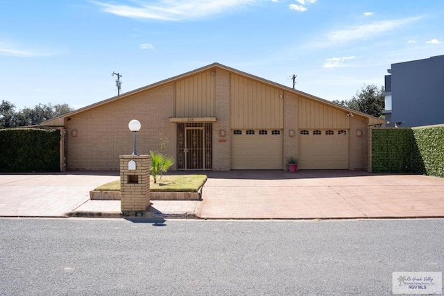 single story home with a garage