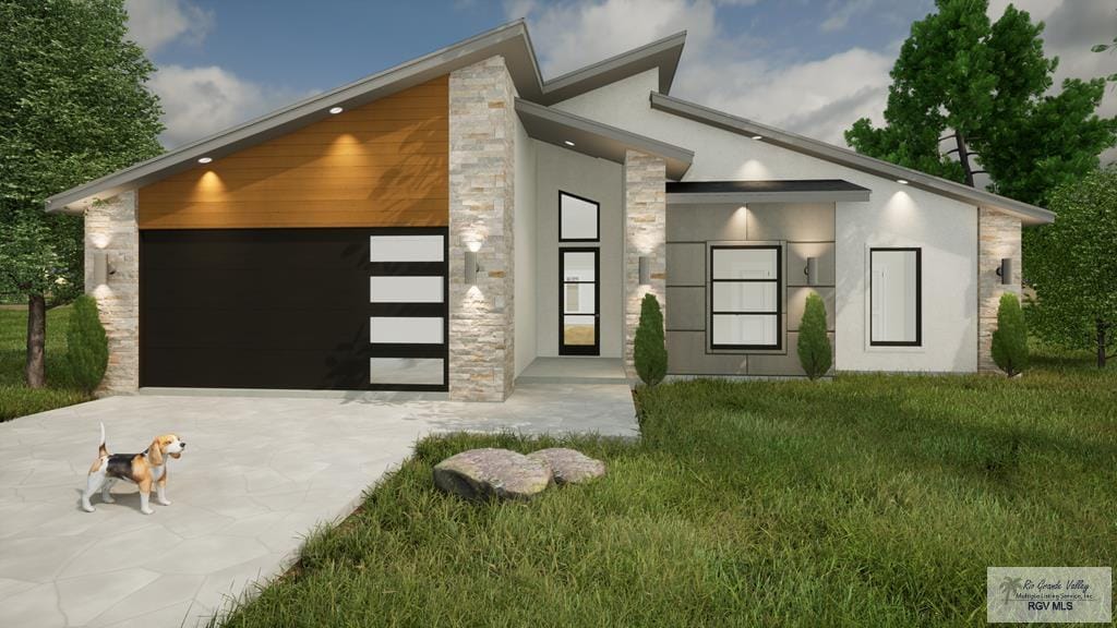 contemporary home with a front yard and a garage