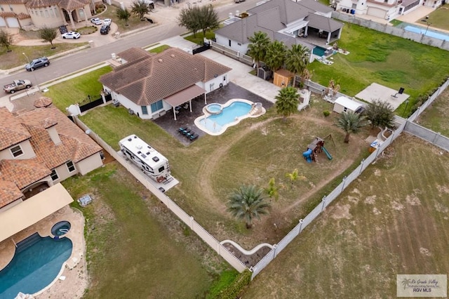 birds eye view of property with a residential view