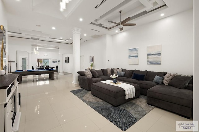 tiled living area featuring visible vents, a ceiling fan, pool table, a high ceiling, and ornate columns