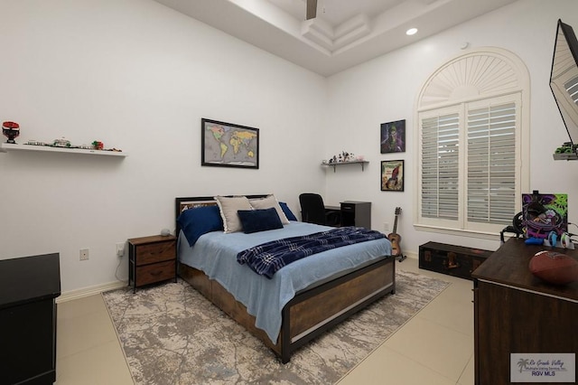 tiled bedroom featuring baseboards and recessed lighting