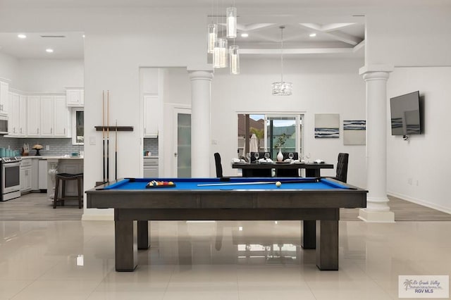 rec room with a towering ceiling, decorative columns, coffered ceiling, and pool table