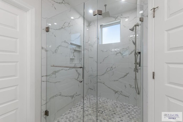 bathroom with an enclosed shower