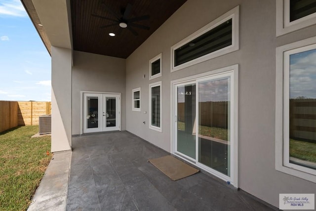 view of patio with central air condition unit, ceiling fan, and french doors